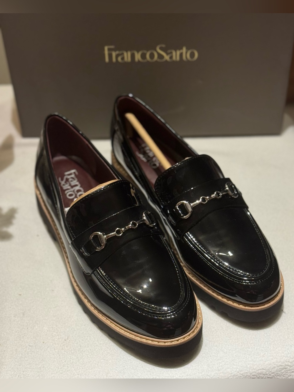 Franco Sarto Women's Colette Bit Loafers
featuring a glossy black Patent leather